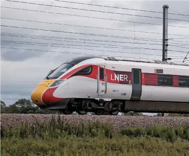  ?? TONY WINWARD. ?? LNER 800113 heads through Tollerton Junction on its way from York to Darlington on July 15. Philip Haigh says the pandemic has given operators and the DfT an opportunit­y to change timetables, such as on the ECML northwards from York where three long-distance franchised operators run to Edinburgh.