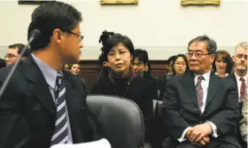  ?? Hyungwon Kang / Reuters 2007 ?? Then-Yahoo CEO Jerry Yang attends a 2007 congressio­nal hearing with Gao Qin Sheng, mother of an imprisoned reporter, and and dissident Harry Wu.
