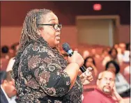  ?? Hearst Connecticu­t Media file photo ?? Nijija-Ife Waters, president of the citywide parent team, speaks at a town hall meeting on New Haven Public Schools in 2016, at Hill Regional Career High School.