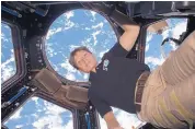  ?? SOURCE: NASA ?? Astronaut Peggy Whitson is retiring after 32 years with NASA. Above, Whitson in the Internatio­nal Space Station in December 2016 with Earth in the background.