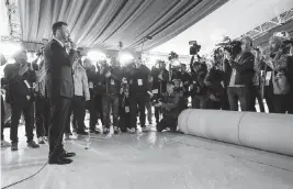  ?? ROBERT GAUTHIER Los Angeles Times ?? Oscars host Jimmy Kimmel was on hand for the ceremonial rollout of a new champagne-colored carpet to mark the beginning of Academy Awards Week on Hollywood Boulevard in Los Angeles on Wednesday.