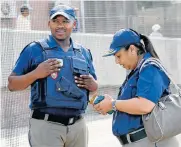  ??  ?? COP PRAISED: Constable Luyolo Nojulumba, who caught the child, with Metro Police chief Yolanda Faro at the court