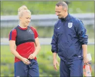  ??  ?? PRIME TIME: England’s Laura Bassett, left, and manager Mark Sampson discuss tactics at yesterday’s training session. PICTURE: PA.