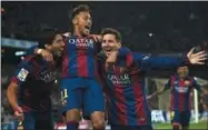  ?? SIU WU — THE ASSOCIATED PRESS FILE PHOTO ?? FC Barcelona’s Lionel Messi, right, Neymar, center, and Luis Suarez, celebrate after scoring against Atletico Madrid during a Spanish La Liga soccer match at the Camp Nou stadium in Barcelona, Spain. Barcelona said, Wednesday Neymar’s 222 million euro...