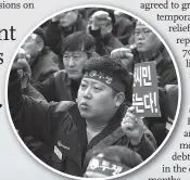  ?? Photo: VCG ?? Inset: Residents protest in Gunsan in March, demanding GM to withdraw its decision to shut down Gunsan plant.
