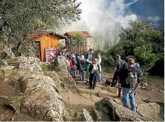  ??  ?? Climbers from around the globe gather at the Huayna Picchu gate.