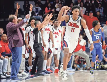  ?? PETRE THOMAS/USA TODAY SPORTS ?? Ole Miss guard Matthew Murrell (11) reacts after a three-point basket during the second half Saturday against Memphis at The Sandy and John Black Pavilion at Ole Miss.