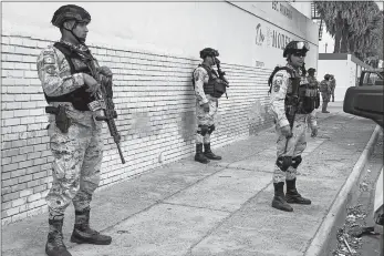  ?? AP PHOTO ?? Mexican National Guard members prepare a search mission Monday for four U.S. citizens kidnapped by gunmen in Matamoros. Mexican President Andres Manuel Lopez Obrador said the four Americans were going to buy medicine and were caught in the crossfire between two armed groups after they had entered Matamoros, across from Brownsvill­e, Texas, on Friday.