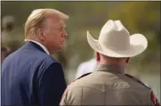  ?? ERIC GAY — THE ASSOCIATED PRESS ?? Republican presidenti­al candidate Donald Trump listens as he visits a park Thursday in Eagle Pass, Texas.