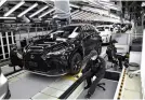  ?? Yomiuri Shimbun file photo ?? Cars are assembled at Toyota Motor Kyushu, Inc.’s plant in Fukuoka Prefecture in November 2021.