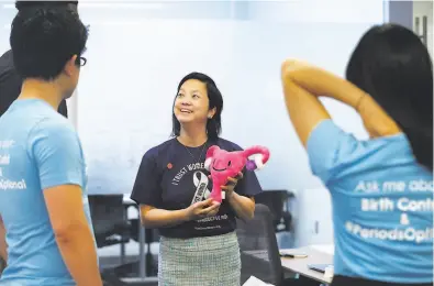  ?? Paul Chinn / The Chronicle ?? Dr. Sophia Yen, CEO and cofounder of the birthcontr­ol delivery startup Pandia Health, meets with colleagues at her Palo Alto workplace. She feels strongly about challengin­g states that have sharply restricted abortion rights and is speaking out.