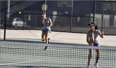  ?? PHOTO AARON BODUS ?? Sarah Huang (front) and Kayla Lee (rear) of Brawley playing out a point in the IVL individual doubles finals at Southwest High School Wednesday afternoon.