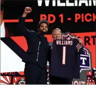  ?? Tribune News Service ?? Caleb Williams, left, poses with NFL Commission­er Roger Goodell after being selected first overall by the Chicago Bears during the first round of the 2024 NFL Draft at Campus Martius Park and Hart Plaza on Thursday.