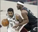  ?? AP photo ?? Kyrie Irving of the Nets drives against the Cavaliers’ Damyean Dotson during the second half Wednesday.