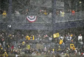  ?? Gene J. Puskar/Associated Press ?? Young fans hoping for the Pirates’ Andrew McCutchen to hit his 300th home run their way the left field stands at PNC Park hold a sign during the eighth inning. in