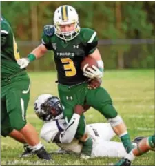  ?? ERIC HARTLINE — FOR DIGITAL FIRST MEDIA ?? Bonner & Prendie back Tom Millison is tackled by Upper Darby linebacker Richard Tougeekay during the first quarter at Upper Darby High School Friday night.