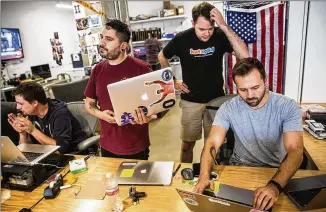  ?? TAMIR KALIFA / AMERICAN-STATESMAN ?? Enterprise engineers assist Facebook employees at a help desk at the company’s newly renovated downtown Austin office. Tech jobs remain in high demand in the area.