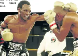  ?? / ANTONIO MUCHAVE ?? Lovemore Ndou, left, pummels challenger Bongani 'Cyclone' Mwelase at Emperor’s Palace in 2010.