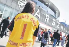  ?? — Reuters photo ?? A supporter wears an Arsenal shirt with ‘There’s only 1 Arsene Wenger’ written on the back ahead of the English Premier League match between Arsenal and West Ham United at the Emirates Stadium in London.