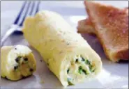  ?? CARL TREMBLAY — AMERICA’S TEST KITCHEN VIA AP ?? This undated photo provided by America’s Test Kitchen shows the Perfect French Omelet in Brookline, Mass. This recipe appears in “Cooking at Home with Bridget & Julia.”