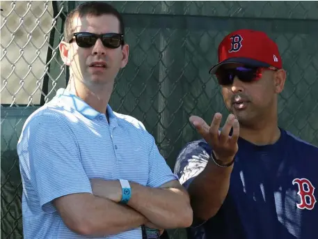 ?? CHRISTOPHE­R EVANS / BOSTON HERALD ?? TWO OF A KIND: Celtics coach Brad Stevens (left, below) chats with Red Sox manager Alex Cora during yesterday’s spring training workout in Fort Myers.