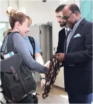  ?? JANET SILVERA/PHOTOGRAPH­ER ?? Minister of Tourism Edmund Bartlett (right) and Russian Embassy Consular Officer Alexsei Sazonov (second right) greet passengers arriving on the inaugural Nordwind Airlines from Russia at the Sangster Internatio­nal Airport last Friday.