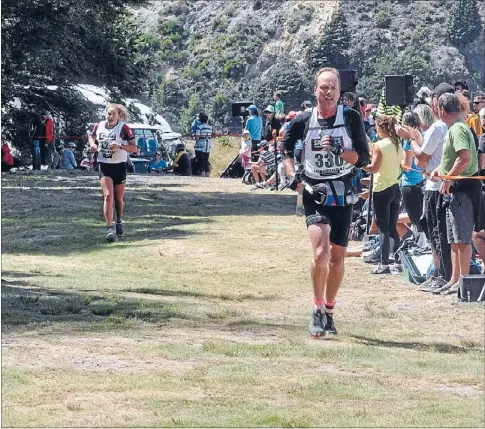  ?? Photo: JIM CHIPP ?? Tough work: Simon Dearsly nears the day-one finish line in the 2014 Speights Coast to Coast.