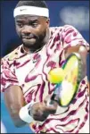  ?? ?? Frances Tiafoe of the U.S., returns a shot from Yosuke Watanuki, of Japan, during the Miami Open tennis tournament in Miami Gardens, Fla. (AP)