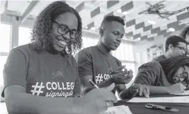  ??  ?? Krystal Revel, 18, signs with Barry University during an event at SLAM Academy Miami in Little Havana on Wednesday.