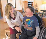  ?? DON USNER/SEARCHLIGH­T NEW MEXICO ?? Siah Hemphill enjoys a quiet moment with her son, Nicholas, in their Silver City house.