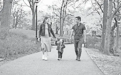  ?? PROVIDED BY THE LIN FAMILY ?? Jaclyn Lin walking with her oldest daughter and husband while she was pregnant.