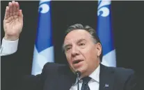  ?? JACQUES BOISSINOT/THE CANADIAN PRESS ?? Premier François Legault said if children do go back to school this spring, it will likely be with some distancing measures still in place.