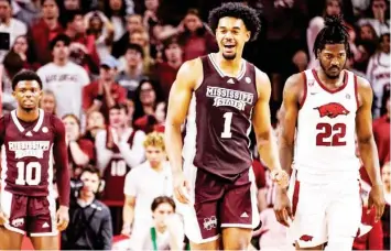  ?? ?? Mississipp­i State forward Tolu Smith flashes a big smile at the end of last Saturday’s game against Arkansas. (By Mike Mattina, MSU Athletics, for Starkville Daily News)