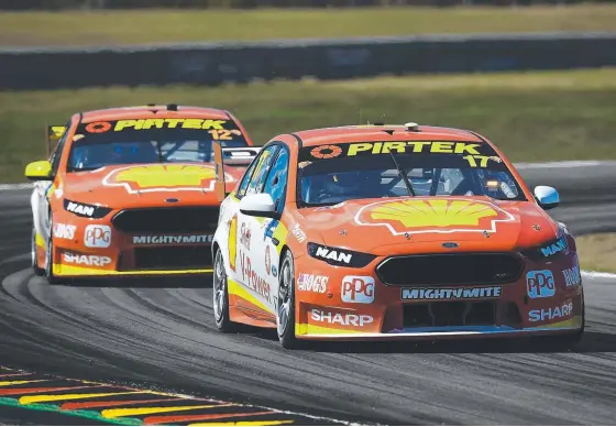  ?? Picture: GETTY IMAGES ?? Fabian Coulthard (rear) is keen to keep up with Scott McLaughlin (front) after another strong weekend for DJR Team Penske in Darwin.