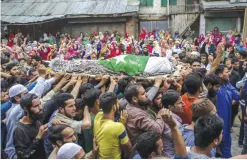  ??  ?? SRINAGAR: Villagers carry the body of Akeel Ahmed Bhat, a teenage boy, during his funeral procession in Haal village, about 47 kilometers south of Srinagar, Indian controlled Kashmir.—AP