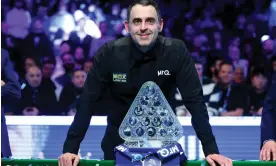  ?? ?? Ronnie O’Sullivan with the Paul Hunter Trophy after his 10-7 victory over Ali Carter in the Masters at Alexandra Palace. Photograph: Richard Pelham/Getty Images