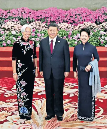  ??  ?? China’s president Xi Jinping and his wife Peng Liyuan welcome IMF chief Christine Lagarde to the Belt and Road Forum yesterday