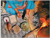  ?? (The New York Times/Poras Chaudhary) ?? A woman makes stuffed roti at the Kalasan Nursery Farm near the town of Karsog in Himachal Pradesh, India. In Himachal Pradesh, the northern Indian state straddling the Western Himalayas, Punjabi and Tibetan flavors meet.