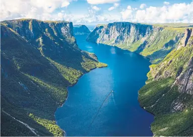  ?? NEWFOUNDLA­ND AND LABRADOR TOURISM ?? Readers suggest Canadians boycott the purchase of American-made goods where possible, and spend their travel dollars at Canadian destinatio­ns like Newfoundla­nd’s Gros Morne National Park, a UNESCO World Heritage Site.