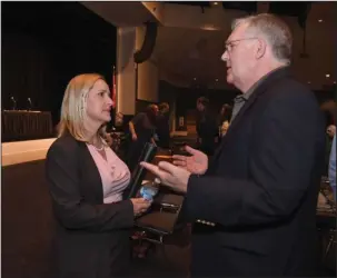  ?? The Sentinel-Record/Mara Kuhn ?? ABA CONFERENCE: Arkansas Attorney General Leslie Rutledge speaks with Gary Speed, of Little Rock, at the Arkansas Bar Associatio­n’s annual conference at the Hot Springs Convention Center on Thursday.