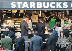  ?? MARK LENNIHAN/THE ASSOCIATED PRESS ?? Starbucks urgently needs to fix the operationa­l challenges that have contribute­d to flat results in its Americas unit as it aims to become a top lunch spot, writes Sarah Halzack.