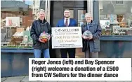  ?? ?? Roger Jones (left) and Bay Spencer (right) welcome a donation of a £500 from CW Sellors for the dinner dance