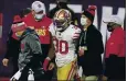  ?? STEVEN SENNE — THE ASSOCIATED PRESS ?? Niners running back Jeff Wilson is helped off the field after suffering an ankle sprain while scoring a TD Sunday.