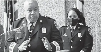  ?? KENNETH K LAM/BALTIMORE SUN ?? Baltimore Police Commission­er Michael Harrison, left, at a March news conference.