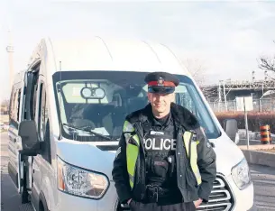  ?? MAY WARREN TORONTO STAR ?? Toronto police Sgt. Brett Moore is one of the officers using special vans to spot distracted drivers.