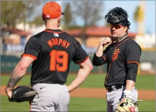  ?? PHOTOS BY RAY CHAVEZ — STAFF PHOTOGRAPH­ER ?? Tom Murphy and Patrick Bailey are expected to be the two catchers the Giants keep for their Opening Day roster. Here, they chat on the fourth day of spring training in Scottsdale, Ariz. on Saturday.