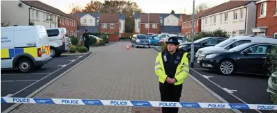  ?? ?? Cordon: Police guard two homes in the new-build estate in Norton Fitzwarren, Somerset