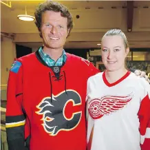  ?? JIM WELLS ?? Ian Sherringto­n, left, a professor at Mount Royal University in the health and physical education department and Cassidy Trotter, student in health and physical education program wore jerseys in support of the victims of the Humboldt Broncos bus crash...