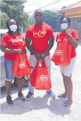  ?? CONTRIBUTE­D ?? Terrel Pencle, CEO of Tea Cup, flanked by volunteers, Sandra Whyte (left) and Nicola Whyte-Williams.