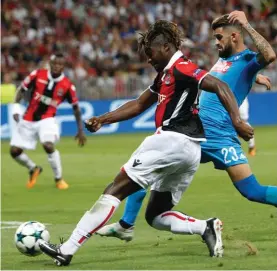  ?? Photo: AP ?? Nice's Allan Saint-Maximin, left, and Napoli's Elseid Hysaj vie for the ball during yesterday’s match.